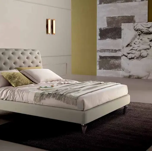 Letto in pelle con testiera lavorazione capitonnè rivisitata senza bottoni Eridano Cosmo Letti
